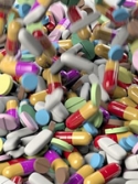 pile of pills of different sizes, shapes, and colors