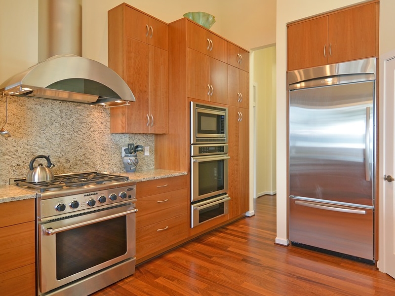 kitchen cabinets, stove, and refrigerator