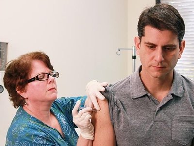 Nurse administering a flu shot