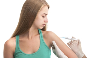 teenage girl gets vaccine