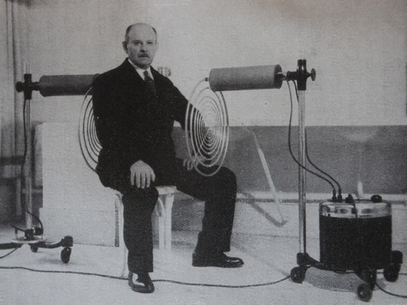 Georges Lakhovsky seated between the coils of his Multi Wave Oscillator