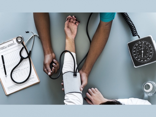 one person testing another person's blood pressure