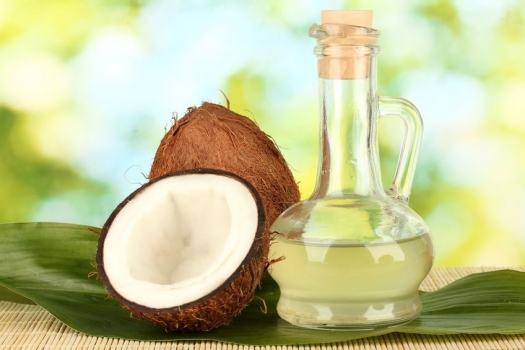 decanter with coconut oil and coconuts