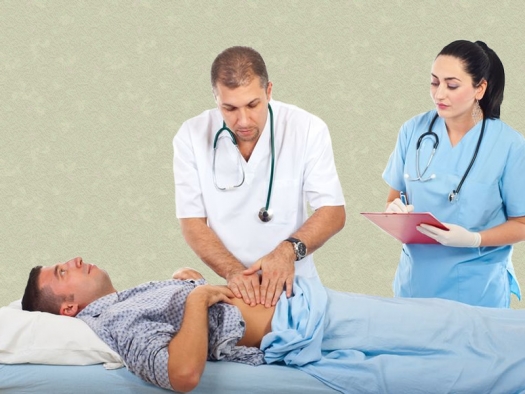 a doctor palpates a patient's abdomen with his hands