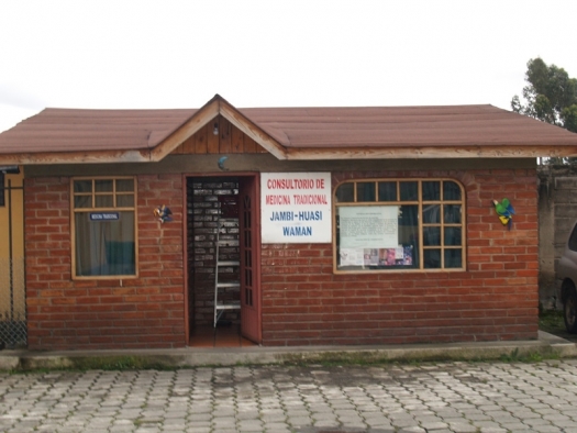 The Guamani Clinic building: small red brick building