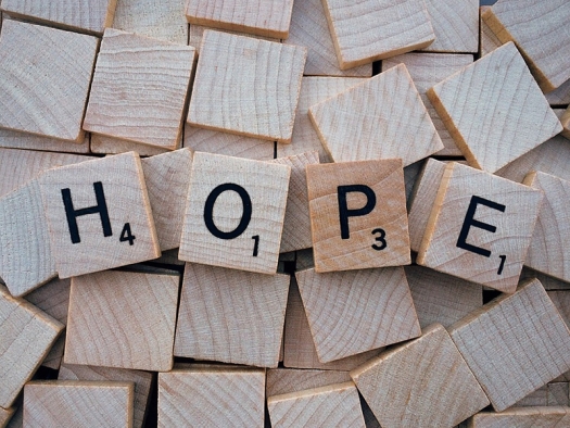 Wood tiles spell the word HOPE