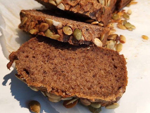 sliced banana bread with pumpkin seeds on top