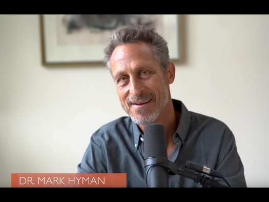 Mark Hyman at microphone.