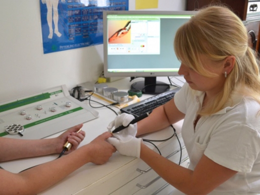 nurse doing lab work on patient's hand