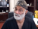 Pradip Jamnadas seated at a desk