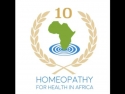 Image of continent of Africa surrounded by olive branches; text says: Homeopathy for Health in Africa