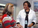 Female doctor meeting with female patient.