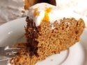 slice of carrot cake with white frosting