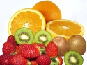 Fresh fruit: oranges (whole and halved), green kiwi (whole and halved), strawberries