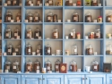 blue shelves with jars of herbs and teas