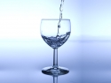 water pouring into clear stem glass