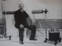Georges Lakhovsky seated between the coils of his Multi Wave Oscillator